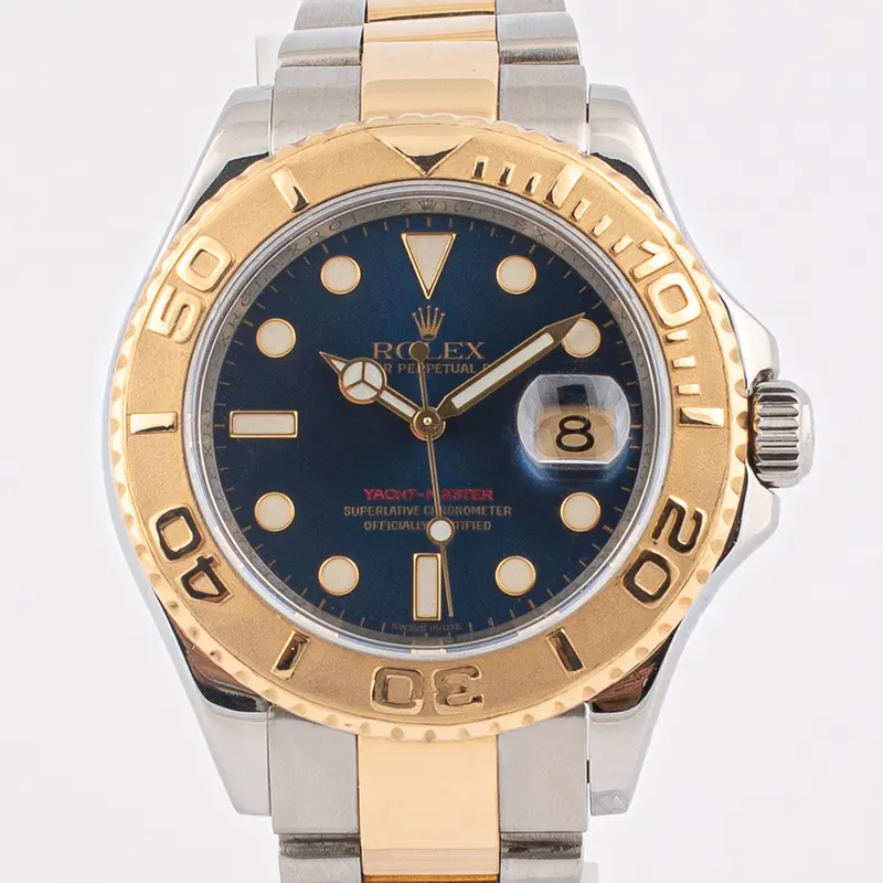 Rolex Yacht-Master two-tone watch with blue dial and gold bezel, luxury sports timepiece.